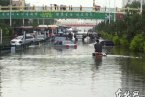 哈尔滨大雨 6月17日哈尔滨下大雨导致路面积水汽车被